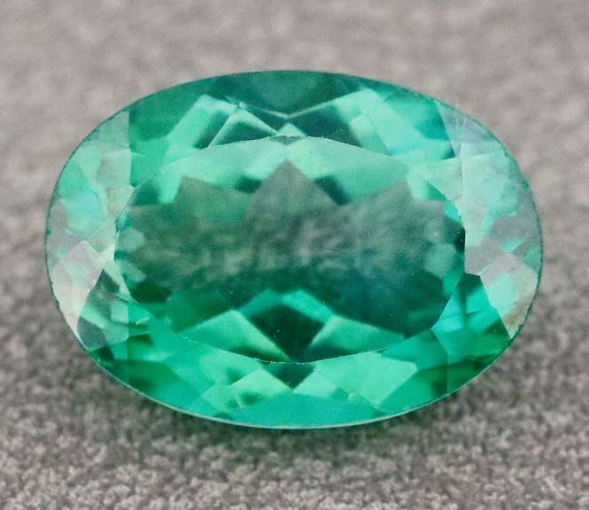 Attention grabbing 7.97ct emerald green Mystic Topaz