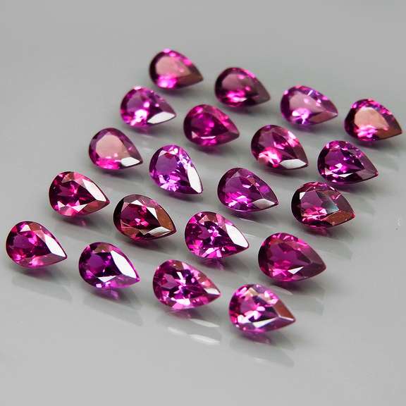 Ravishing 8.99ct violet pink Rhodolite Garnet set
