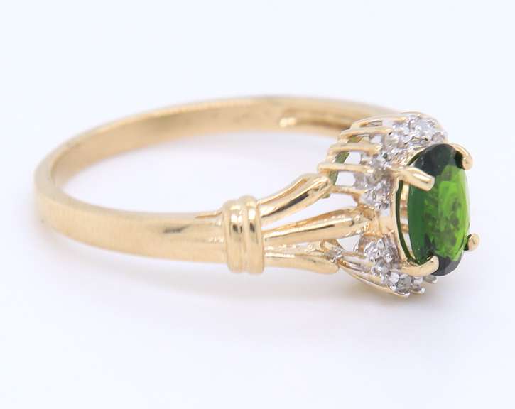 Charming Yellow Gold oval Peridot and Diamond Halo Ring