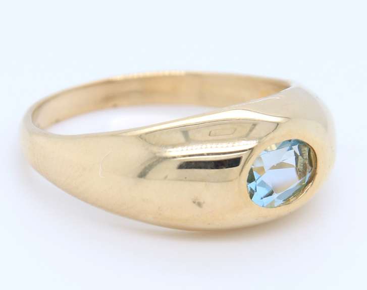 Handsome Yellow Gold oval Blue Topaz Bezel Set Ring