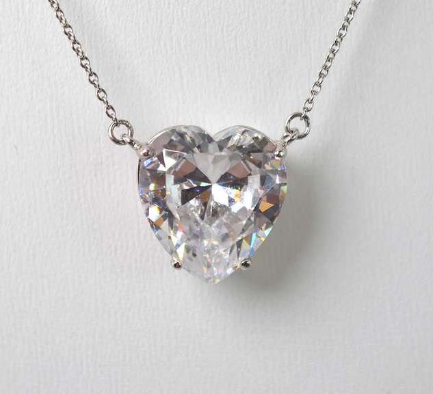 Bright CZ Set In A Sterling Silver Pendant On A Sterling Silver Chain.