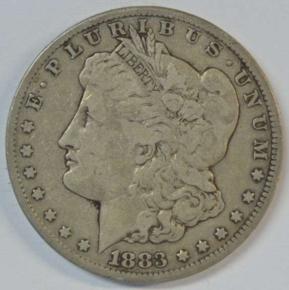 Scarce key date 1883-CC Morgan Silver Dollar. Nice circ