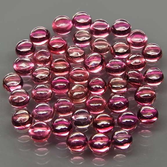 Fancy colored 4.55ct Songean Sapphire cabochon parcel