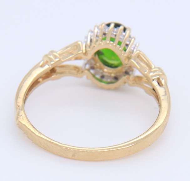 Charming Yellow Gold oval Peridot and Diamond Halo Ring