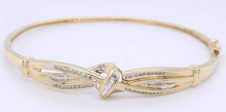 Pleasing Yellow Gold Diamond Baguette Crossover Bangle Bracelet
