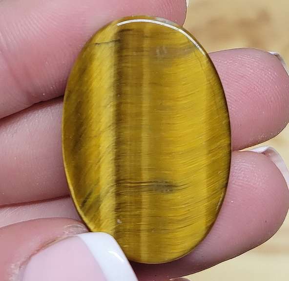 Full body shimmer! 30.41ct Golden Tiger Eye cabochon