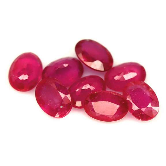 Vibrant 8.22ct oval cut imperial red Ruby set