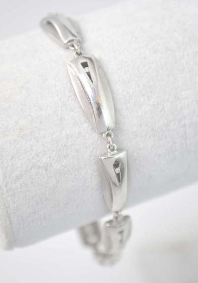 Stylish Sterling Silver Bracelet With CZ Stones And Alternating Matte And Polished Texture.