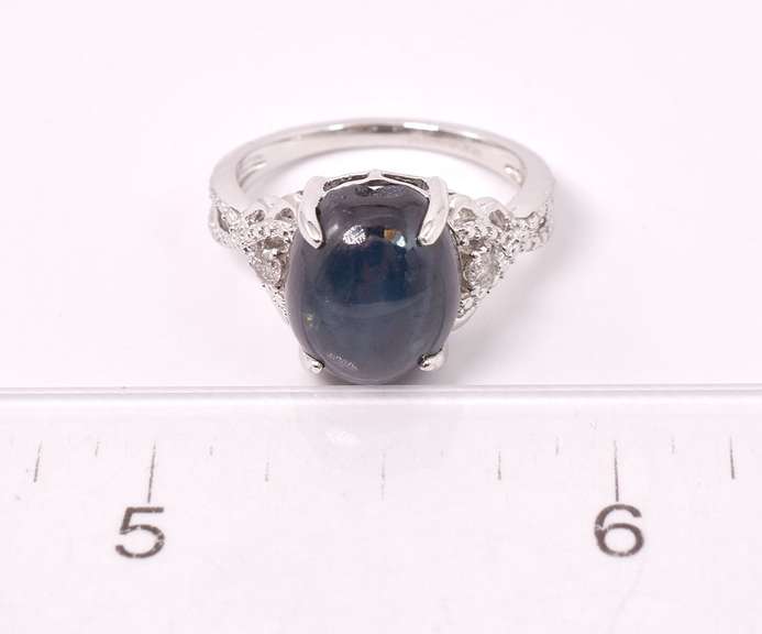 Stunning 8.61CTS Cabochon-Cut Star Sapphire and 0.09CTW Diamond Ring in Sterling Silver