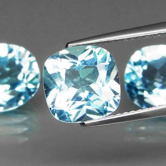 Large 11.91ct vivid blue mixed cut Topaz set
