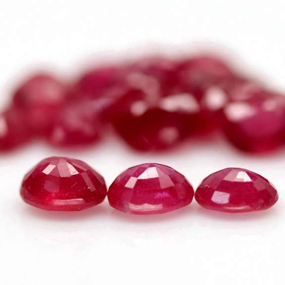 Vibrant 8.44ct oval cut imperial red Ruby set
