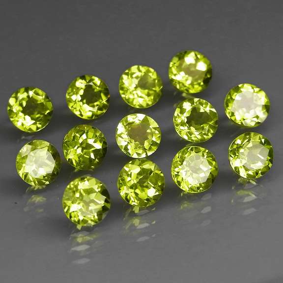 Fantastic 7.00ct 5mm round brilliant cut Peridot set