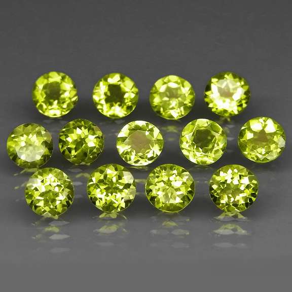 Fantastic 7.00ct 5mm round brilliant cut Peridot set