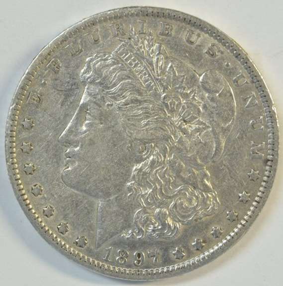Solid AU 1897-O Morgan Silver Dollar. Better date