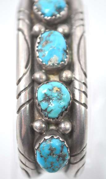 5 Turquoise Stones Set In A Thick Sterling Silver Bracelet.