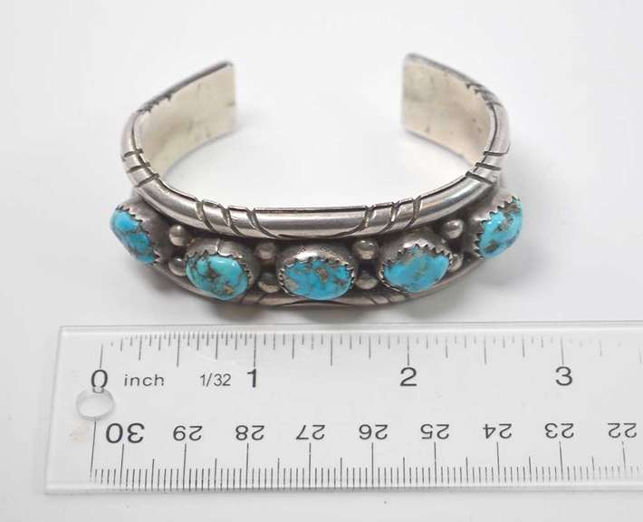 5 Turquoise Stones Set In A Thick Sterling Silver Bracelet.