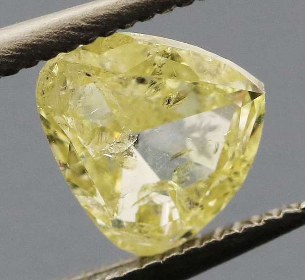 Amazing .60ct pear cut canary yellow Diamond