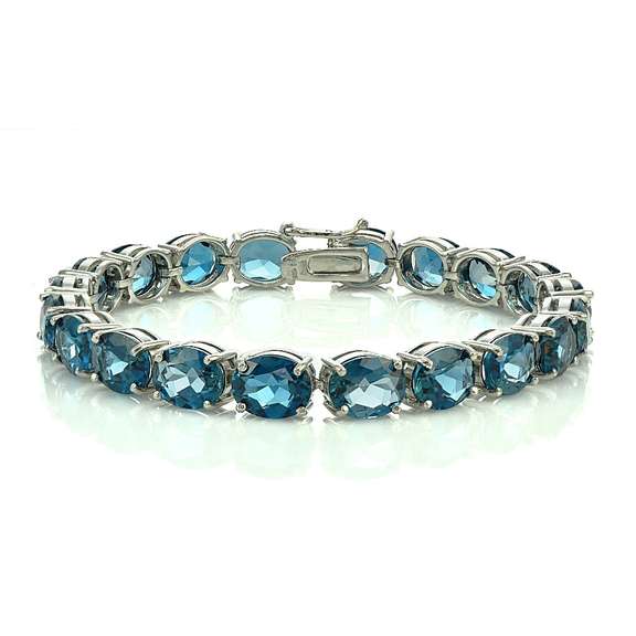 Sterling Silver 42ct London Blue Topaz 9x7mm Oval Tennis Bracelet