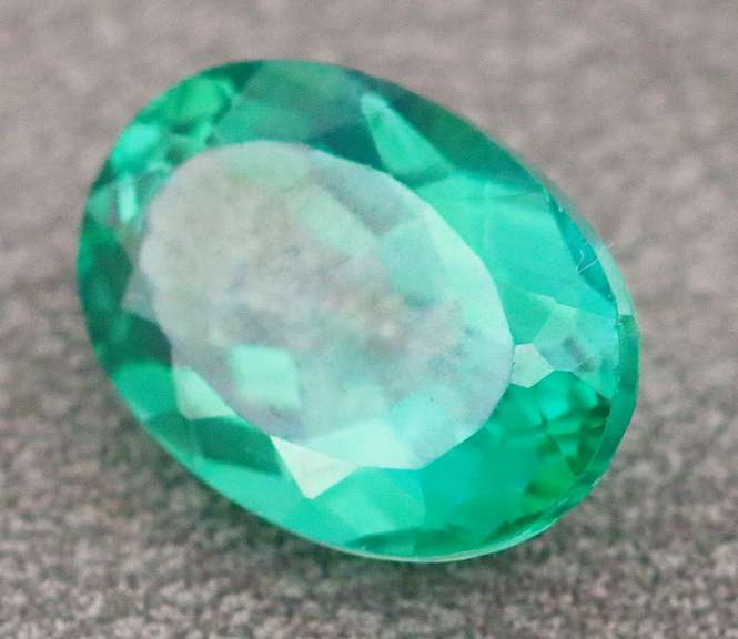 Attention grabbing 7.97ct emerald green Mystic Topaz