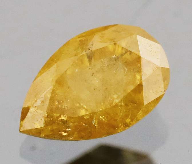 Rare .39ct pear cut yellow Diamond