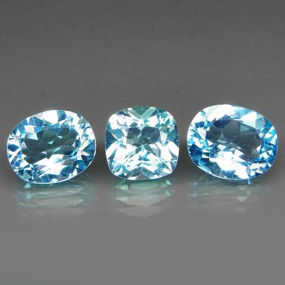 Large 11.91ct vivid blue mixed cut Topaz set