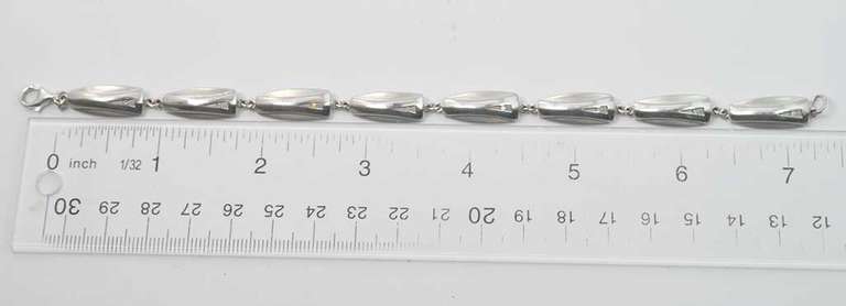 Stylish Sterling Silver Bracelet With CZ Stones And Alternating Matte And Polished Texture.