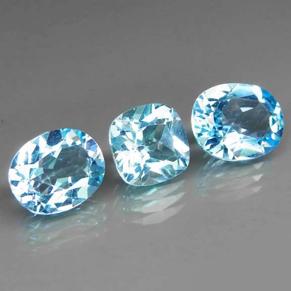 Large 11.91ct vivid blue mixed cut Topaz set