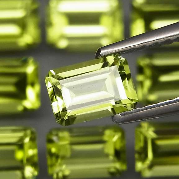 Brilliant 7.62ct 12pc set of matched emerald cut Peridot