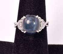 Stunning 8.61CTS Cabochon-Cut Star Sapphire and 0.09CTW Diamond Ring in Sterling Silver