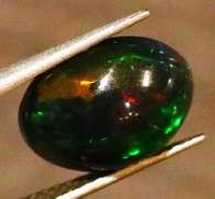 Gorgeous 1.72ct ribbon flashing Black Opal