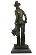 Cowboy with Saddle and Gun Bronze Sculpture