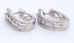 Dazzling White Gold Triple Wave Diamond Huggie Earrings