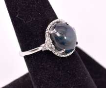Beautiful 5.96CTS Cabochon-Cut Star Sapphire and 0.29CTW Diamond Ring in Sterling Silver
