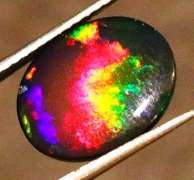 Striking 2.39ct full body and full spectrum flashing Black Opal