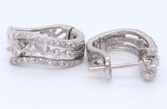 Dazzling White Gold Triple Wave Diamond Huggie Earrings