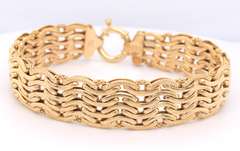 Handsome Yellow Gold High Polished and Textured Wave Wide Bracelet
