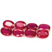 Vibrant 8.22ct oval cut imperial red Ruby set