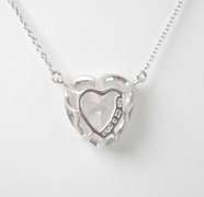 Bright CZ Set In A Sterling Silver Pendant On A Sterling Silver Chain.