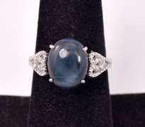 Brilliant 7.32CTS Cabochon-Cut Star Sapphire & 0.08CTW Diamond Ring in Sterling Silver