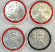 4 Diff. Superb Gem BU $1 Silver Eagles in custom capsules
