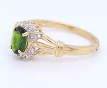 Charming Yellow Gold oval Peridot and Diamond Halo Ring