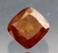 Stunning .28ct cushion cut red orange Diamond