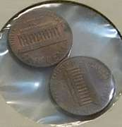 2 error coins: Lincolns, inclusion & cud