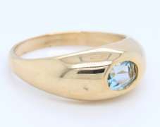 Handsome Yellow Gold oval Blue Topaz Bezel Set Ring