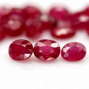 Vibrant 8.44ct oval cut imperial red Ruby set