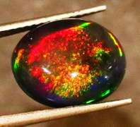 Striking 2.39ct full body and full spectrum flashing Black Opal