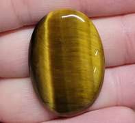 Full body shimmer! 30.41ct Golden Tiger Eye cabochon