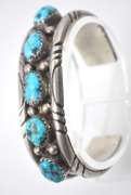 5 Turquoise Stones Set In A Thick Sterling Silver Bracelet.