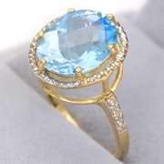 14kt Yellow Gold Oval Blue Topaz 5.48 Square Moissanite 0.03 Oval Blue Topaz 4.88