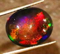 Striking 2.39ct full body and full spectrum flashing Black Opal